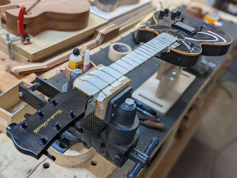 guitar being set up